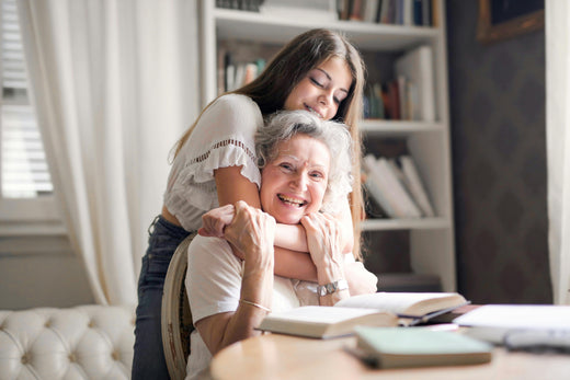 A granddaughter and a grandmother.