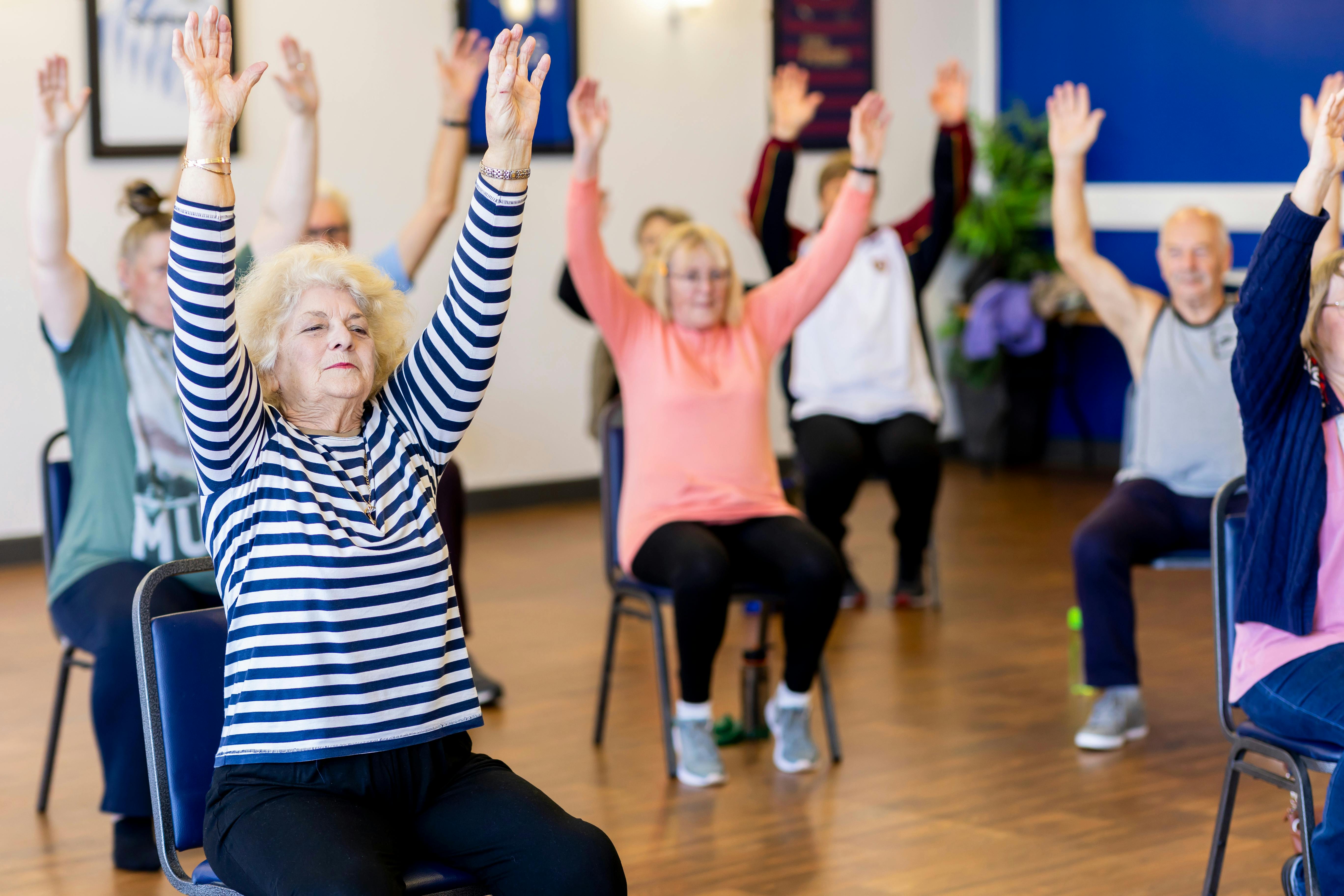 Elderly people doing exercises