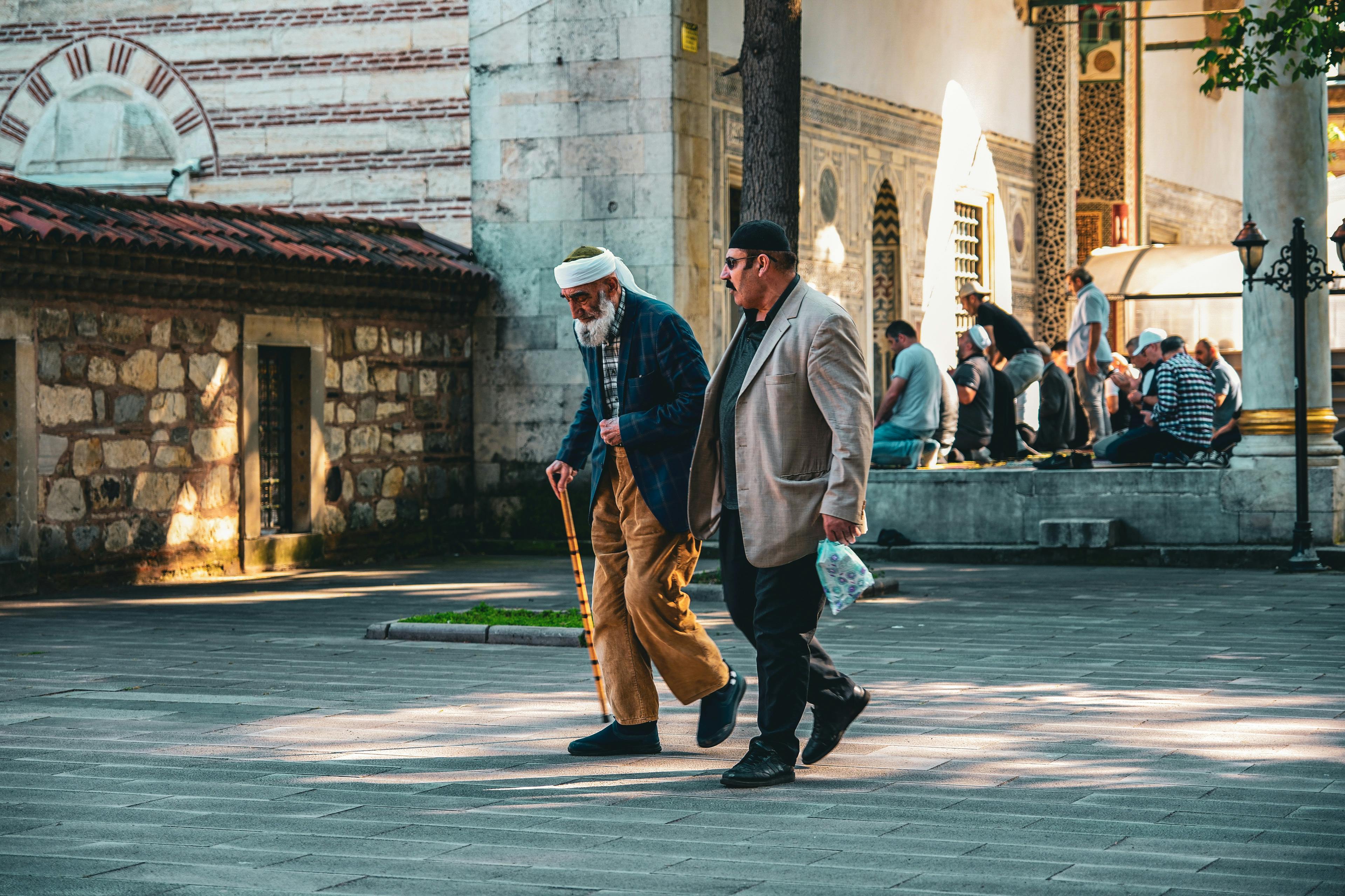 Two men walking down the street
